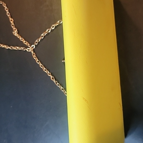 Aldo Yellow Clutch some spots.  Has a snap closure and chain shoulder strap - Picture 6 of 8